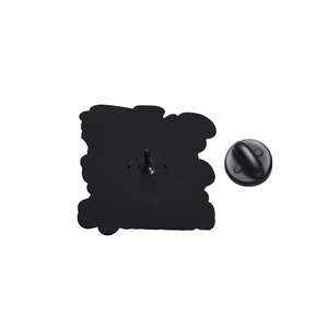 Macro detail of the matte black zinc alloy pin back and matching rubber clutch closure