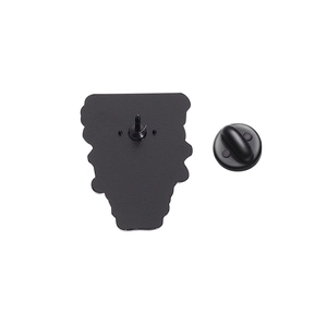 Detail showing the back of the frog enamel pin with a black rubber clutch and needle