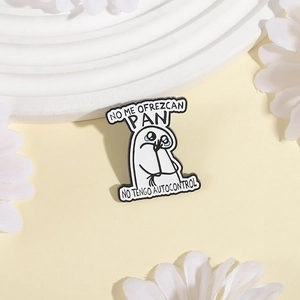 Funny 'No Me Ofrezcan Pan' white enamel pin with cartoon crying face on white surface