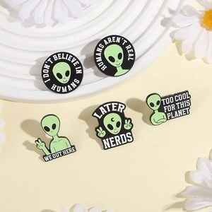 Punk style green alien skull enamel pin set featuring five unique sci-fi designs
