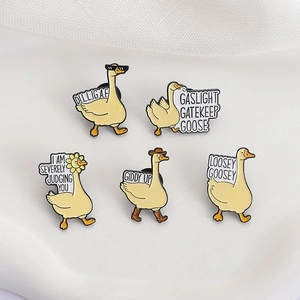 Funny yellow goose enamel pins set with humorous quotes and cartoon accessories