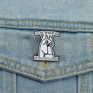 Funny Flork enamel pin with Spanish text on blue denim jacket pocket for fashion styling