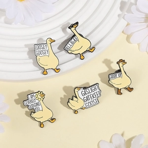 Funny cartoon goose enamel pin set with witty quotes on white decorative platforms