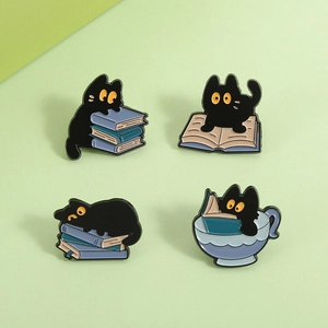 Set of four black cat enamel pins featuring cute cats reading books and in a teacup