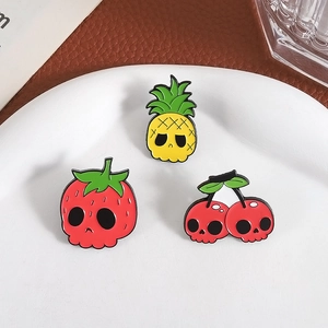 Creative Halloween fruit skull pins featuring pineapple strawberry and cherry enamel designs