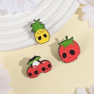Creative fruit skull enamel pin set featuring pineapple strawberry and cherry designs