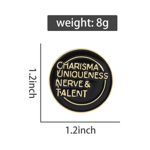 Detail showing 1.2-inch enamel pin with gold text on black background and size specs