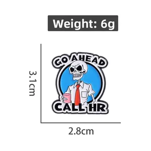 Detail view of cartoon skeleton enamel pin with 'GO AHEAD CALL HR' text and dimensions