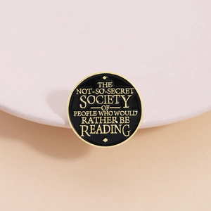 Inspirational enamel pin with the text 'The Not-So-Secret Society of People Who Would Rather Be Reading'
