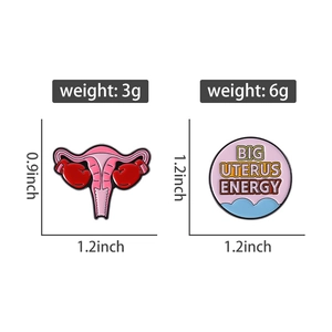 Detailed size and weight view of pink uterus enamel pin and Big Uterus Energy brooch