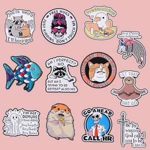 Set of 12 creative enamel pins featuring cartoon animals and humorous English quotes