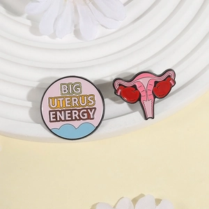 Uterus power enamel pins set with Big Uterus Energy slogan and boxing glove design