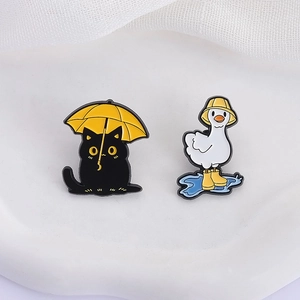 Cartoon black cat with umbrella and duck in rain boots enamel pin badge set