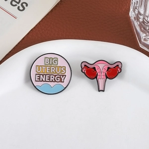 Big Uterus Energy enamel pins set with boxing gloves for women's health awareness