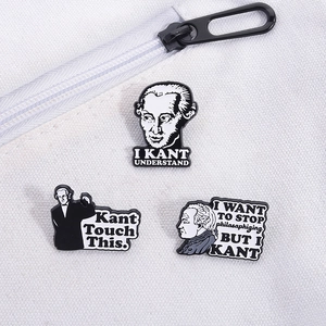 Detail of Immanuel Kant enamel pins with funny academic puns on white canvas background