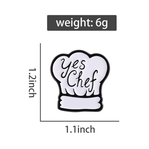 Detail view of white enamel chef hat pin with 'yes Chef' text and size dimensions