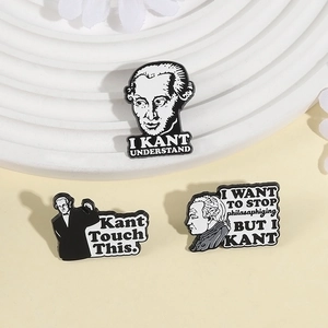 Three-piece Kant philosopher enamel pin set with humorous typography on a pedestal