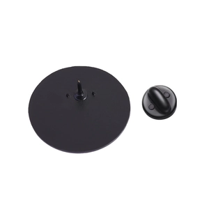 Detail view of the black round metal pin back mechanism with safety clasp and positioning pins