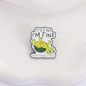 Funny cartoon turtle enamel pin with humorous I'M FINE quote on white background