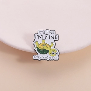 Funny green turtle enamel pin with 'I'M FINE' text on minimalist white background