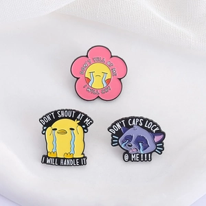 Three-piece cartoon enamel pin set featuring crying duck, raccoon, and pink flower badges