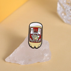 Retro Mel's Organic Lemonade enamel pin with lemon graphics on a crystal stone