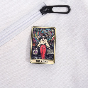 Detail of The ADHD tarot card enamel pin with artistic illustration on canvas background