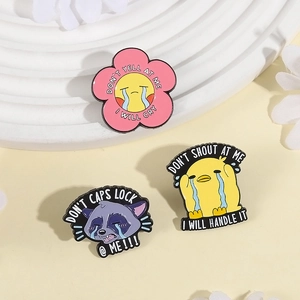 Three creative cartoon enamel pins featuring crying duck and raccoon with humorous quotes