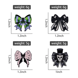 Set of four Gothic Halloween enamel pins featuring bows with ghost, bat and skull designs