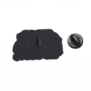 Detail view of the matte black metal brooch back with rubber butterfly clutch fastener