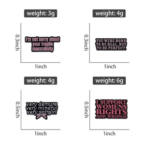Detail view of four feminist enamel pins with pink typography and measurements