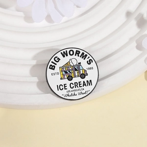 Retro white enamel round badge with yellow cartoon ice cream truck and lettering