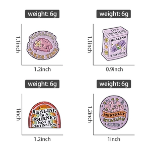 Detailed view of four pink mental health enamel pins with size and weight measurements