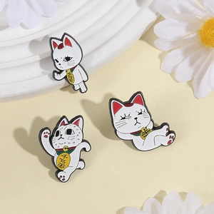Three-piece set of lucky cat enamel pins featuring fun cartoon poses and gold lettering