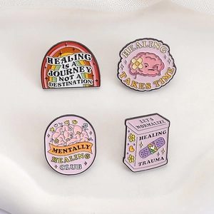 Pink mental health enamel pins set with healing quotes and medical brain designs