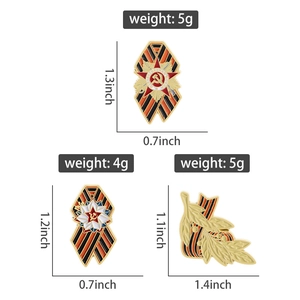 Detail view of Victory Day pins with St. George ribbon and hammer sickle emblem icons