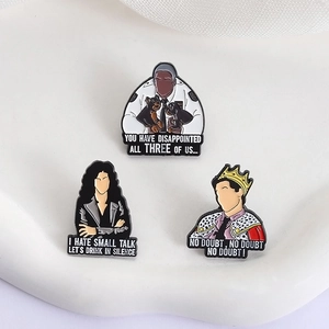 Detailed view of Brooklyn Nine-Nine enamel pins featuring characters and iconic quotes