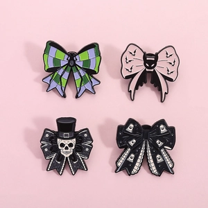 Set of 4 Gothic Halloween bow enamel pins featuring skull, bat, and ghost motifs
