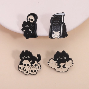 Set of 4 Halloween cat enamel pins featuring grim reaper and skeleton motifs on a white stand