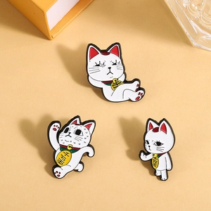Three cute white lucky cat enamel pins set with fun poses and bells for backpacks
