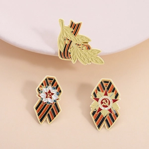 Three-piece Soviet-style commemorative enamel pins with St. George ribbons and red star