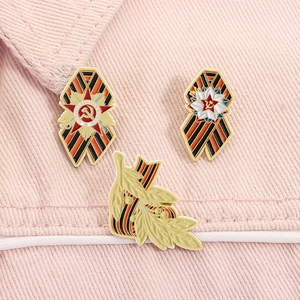 Detailed set of Soviet medal enamel pins with St. George ribbon on denim fabric