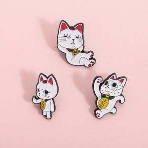 Three Japanese Maneki Neko enamel pin set with lucky coins on pink background