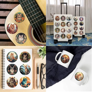 Close-up of waterproof cat stickers applied to a guitar and laptop surface