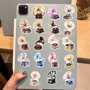 Retro gramophone stickers displayed on a tablet back with various vintage watercolor designs