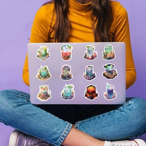 Close-up of artistic micro-world stickers applied to a purple laptop for DIY decoration