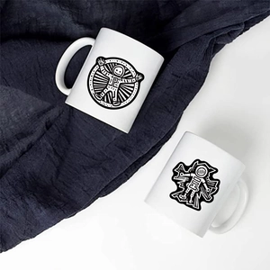 Top view of two white ceramic mugs featuring artistic black and white astronaut illustrations