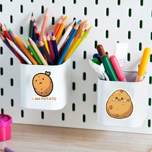 Close-up of cute cartoon potato stickers on a white organizer with I AM POTATO text