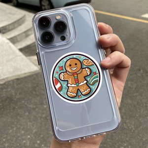 Close-up of clear phone case with gingerbread man cartoon design on a smartphone