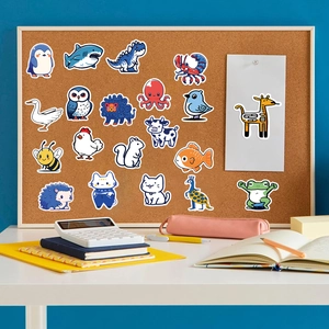 Blue animal cartoon stickers set on a corkboard with stationery for DIY decoration